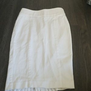 White bebe pencil skirt with ruffles in back